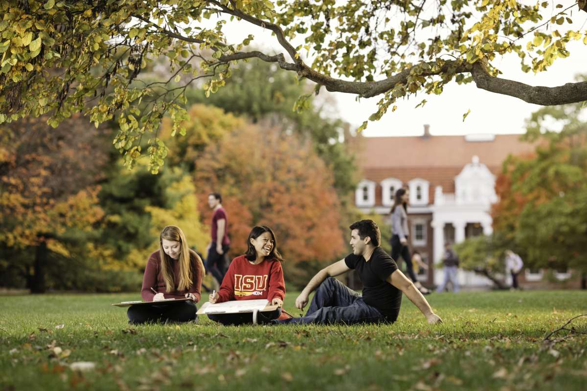 Students Sitting on Lawn