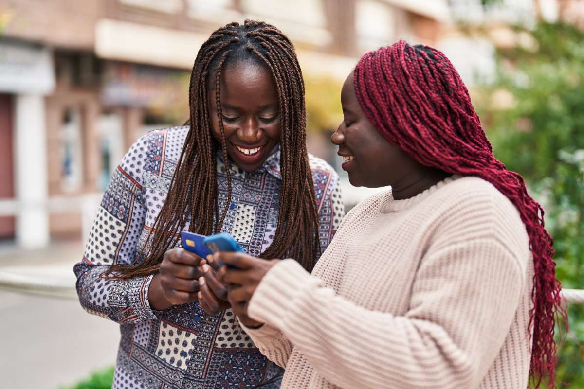 Two people laughing with phone