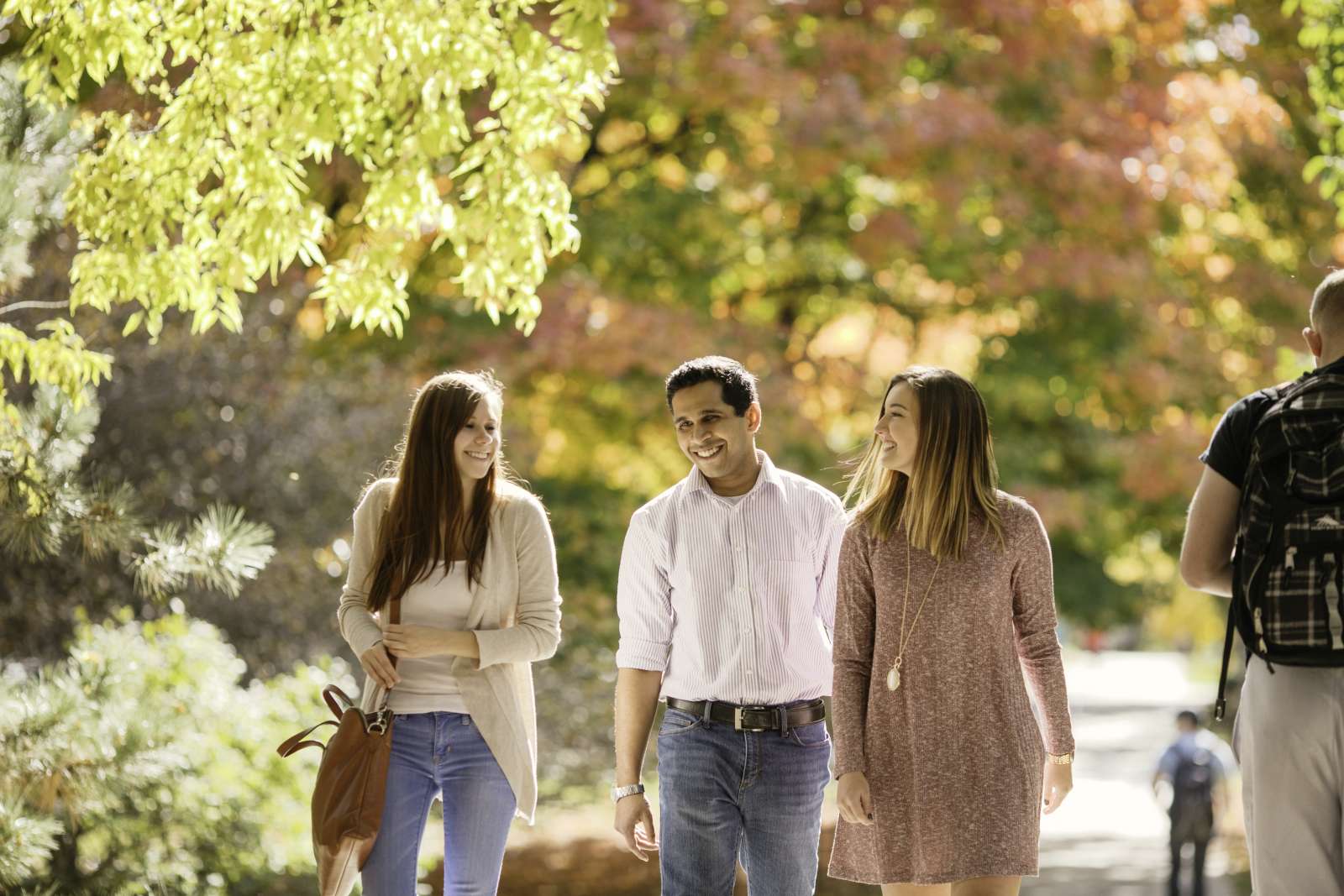 Students walking and smiling